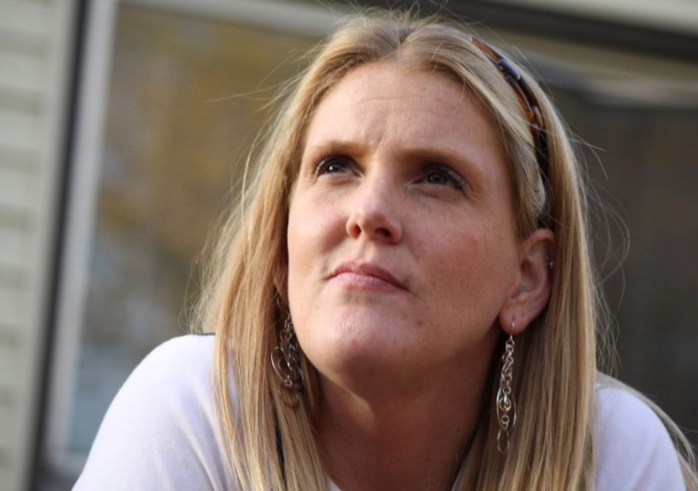 Amy Grace, looking quietly upward in soft daylight